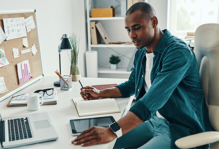 A young man is planning a marketing campaign. A young man is planning a marketing campaign.